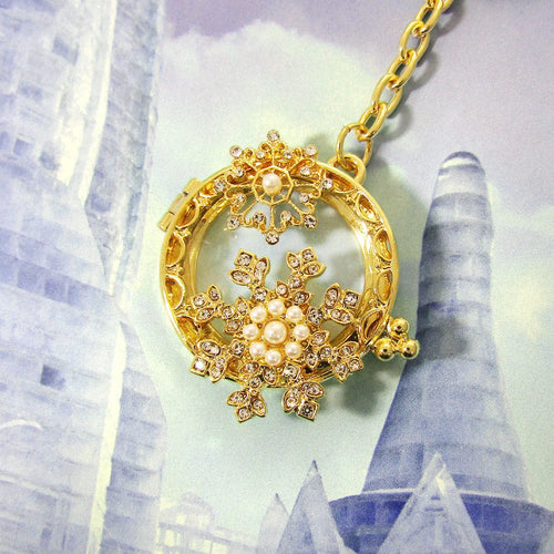 Pearl Snowflake pendant slides open to expose unobstructed magnifying glass